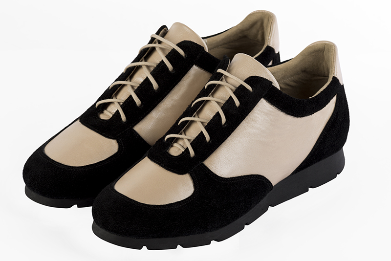 Matt black and gold women's two-tone elegant sneakers. Round toe. Flat rubber soles. Front view - Florence KOOIJMAN